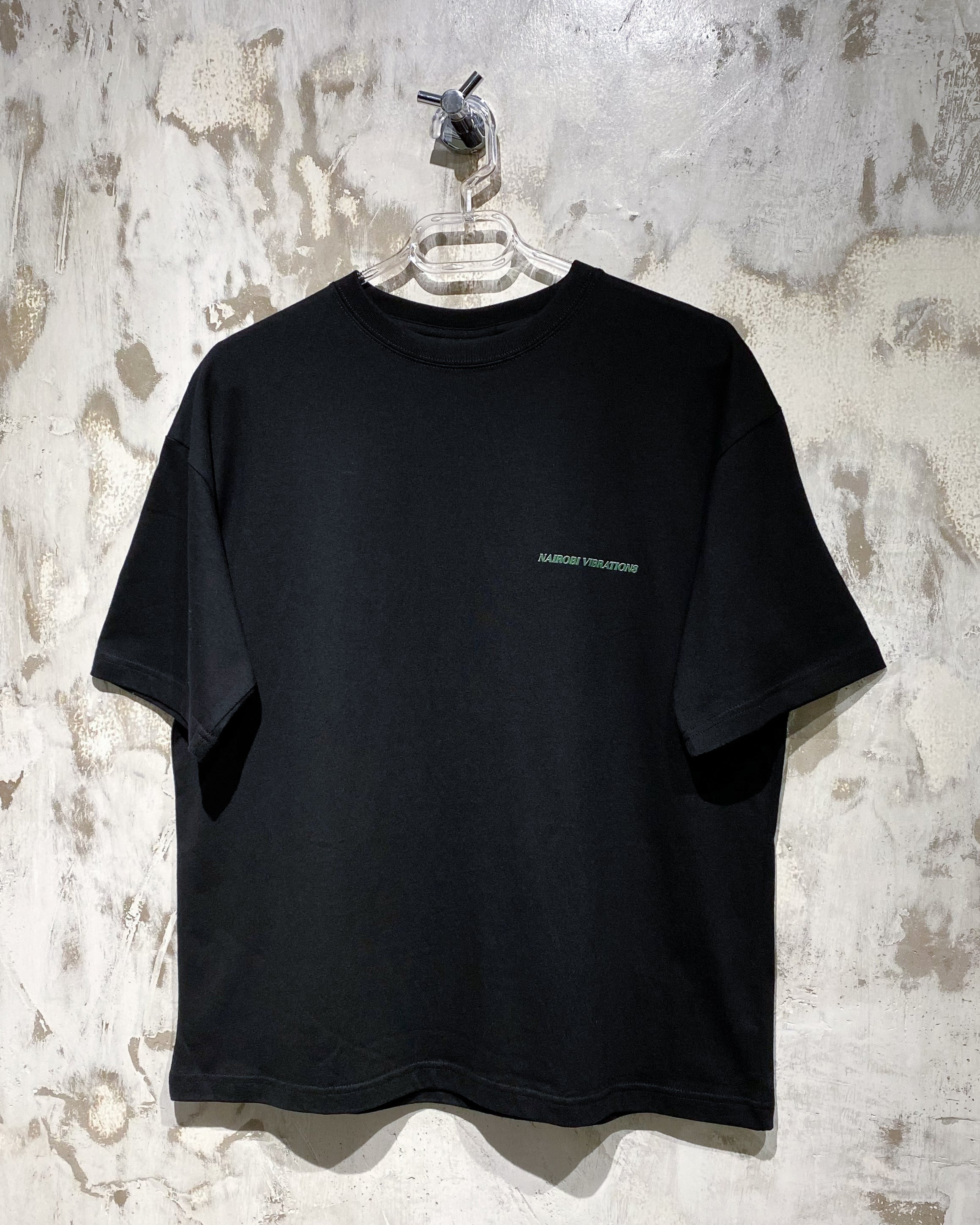 Nairobi Vibrations Black T-Shirt with Green Ink
