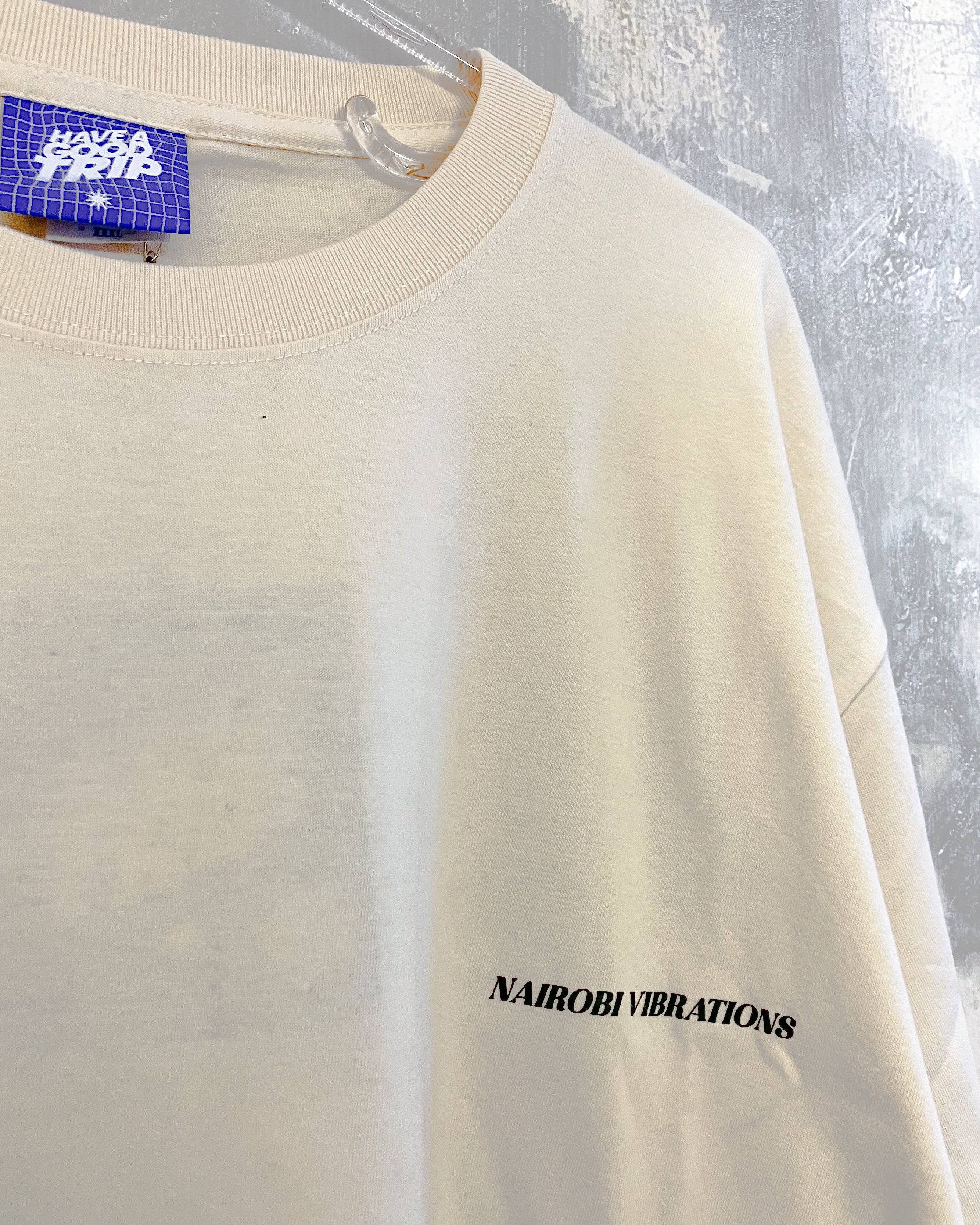 Nairobi Vibrations Natural T-Shirt with Green Ink