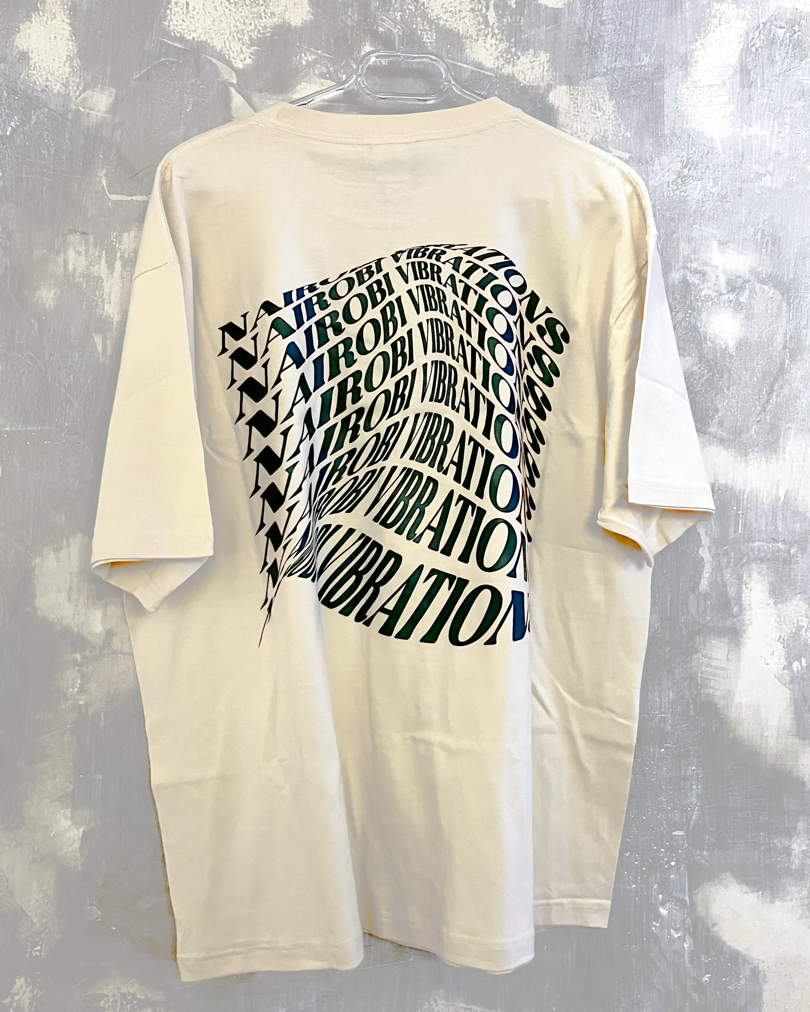 Nairobi Vibrations Natural T-Shirt with Green Ink